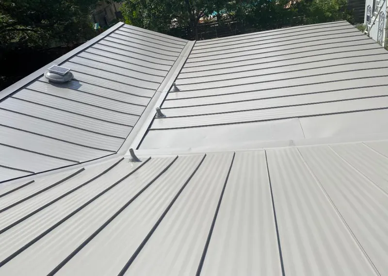 Solar attic fan installed on a metal roof for Roof Ventilation in South Elgin